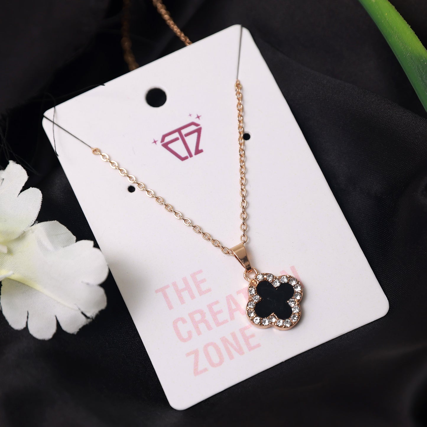 Rose Gold Necklace with Clover Pendant Studded with Black and White Crystals